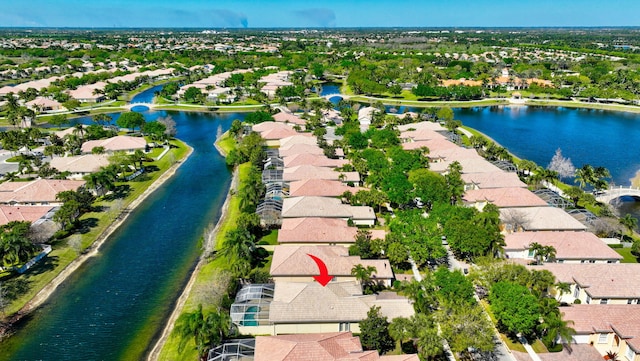 birds eye view of property featuring a residential view and a water view