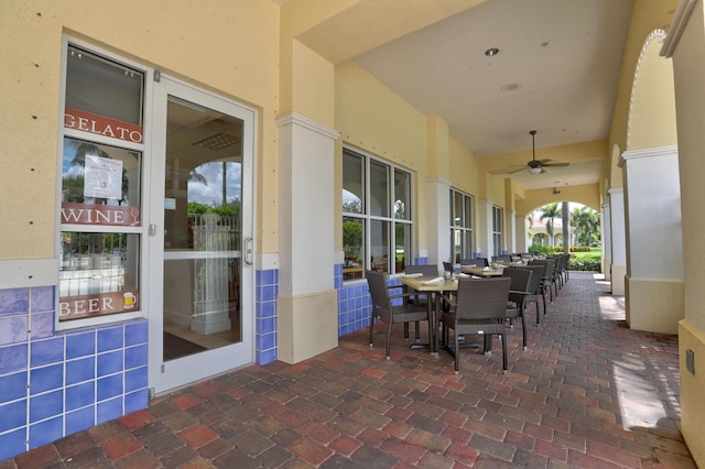 view of patio / terrace featuring outdoor dining area and a ceiling fan