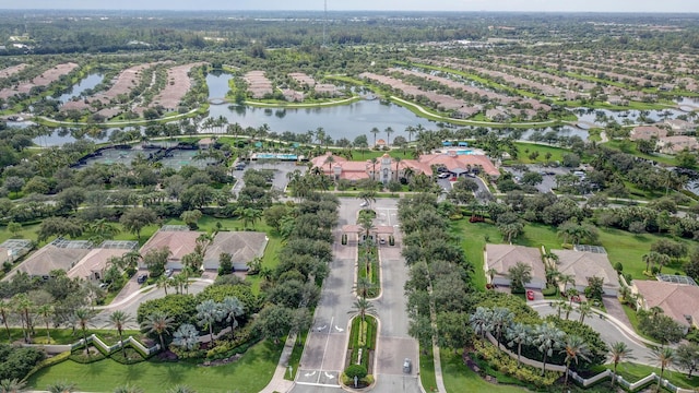 birds eye view of property featuring a water view and a residential view