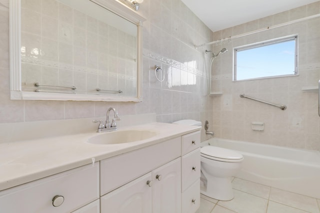 full bathroom featuring toilet, tile walls, vanity, tub / shower combination, and tile patterned floors