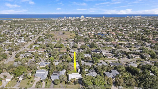 drone / aerial view with a water view