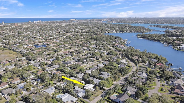 drone / aerial view with a water view and a residential view