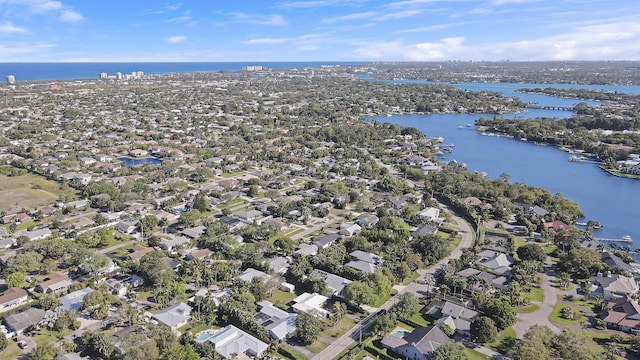 birds eye view of property featuring a water view and a residential view