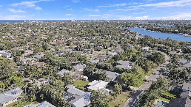 birds eye view of property featuring a water view and a residential view