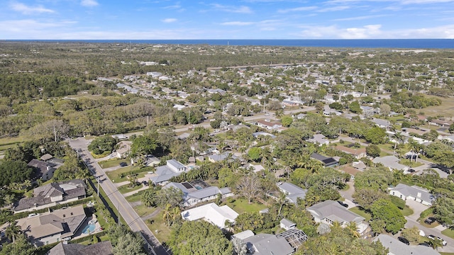 bird's eye view featuring a residential view and a water view