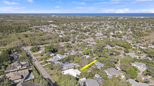 aerial view featuring a water view and a residential view