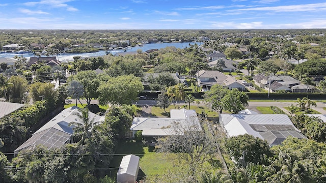 birds eye view of property featuring a water view and a residential view