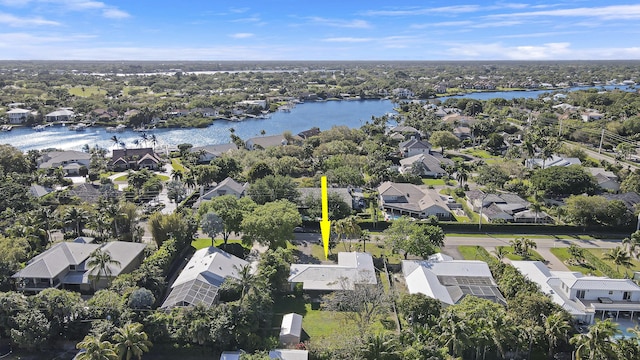 bird's eye view featuring a water view and a residential view