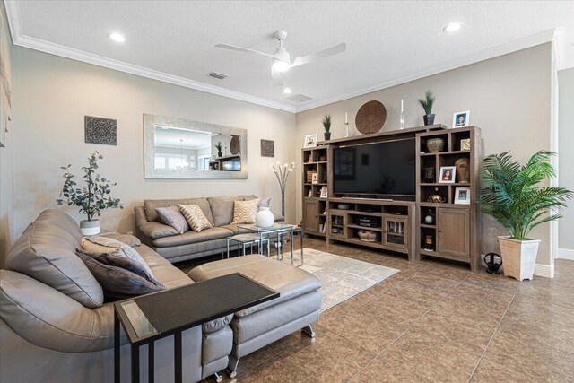 living area with visible vents, a textured ceiling, and ornamental molding