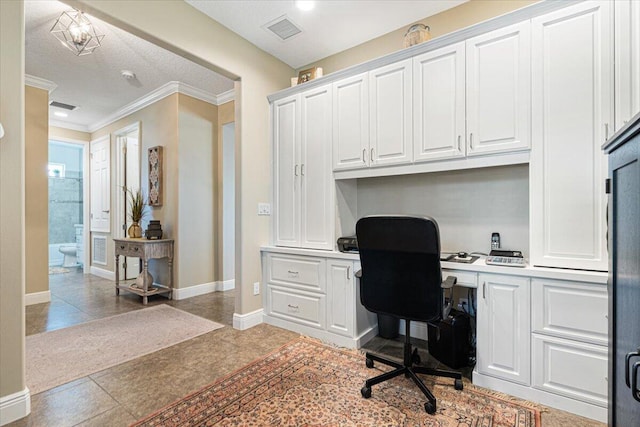 tiled office with baseboards, built in study area, visible vents, and crown molding