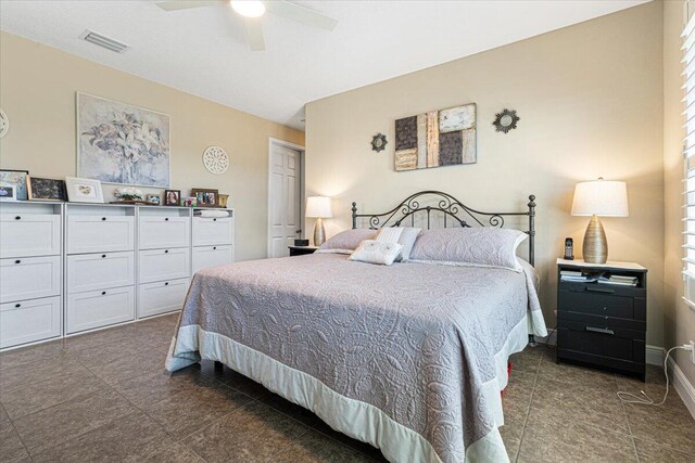 bedroom with visible vents, ceiling fan, and baseboards