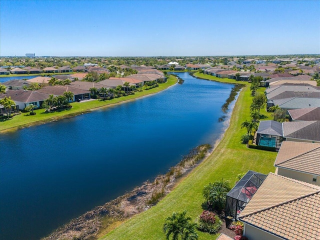 drone / aerial view featuring a water view and a residential view