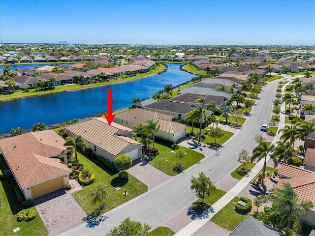 aerial view with a residential view and a water view