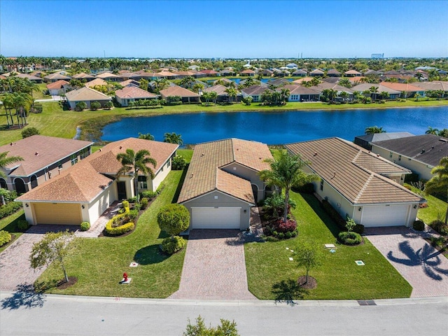 aerial view with a water view and a residential view