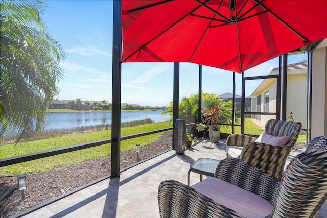 sunroom with a water view and plenty of natural light