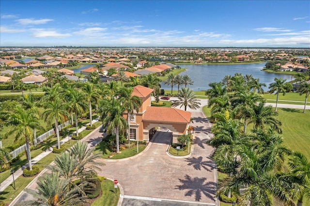 drone / aerial view with a water view and a residential view