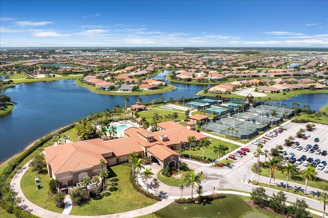 birds eye view of property with a water view and a residential view