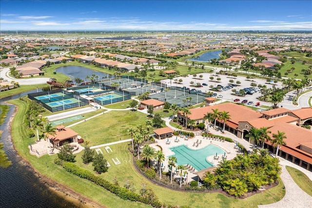 birds eye view of property with a water view and a residential view