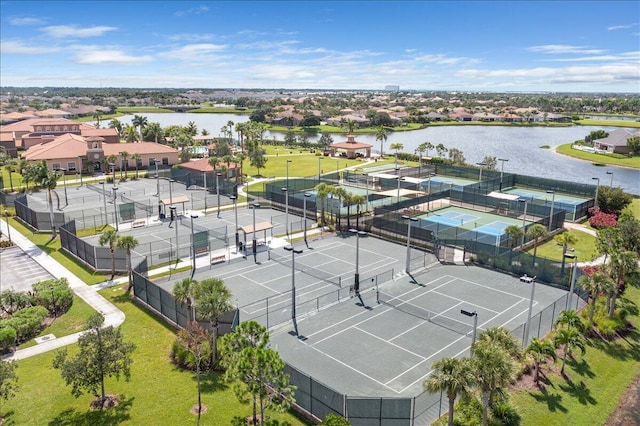 bird's eye view featuring a water view and a residential view