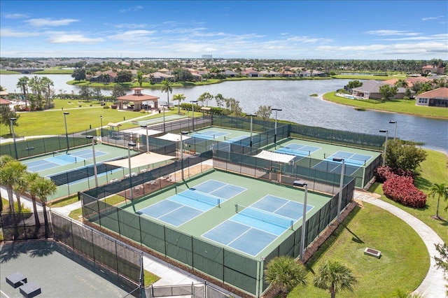 bird's eye view featuring a water view and a residential view