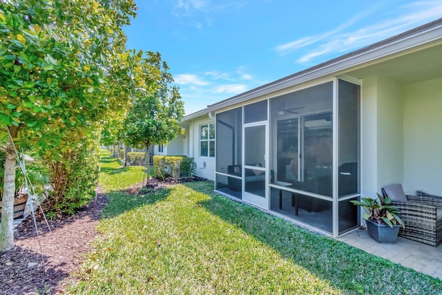 view of yard featuring a sunroom