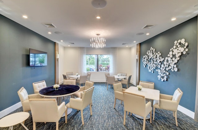 carpeted dining room featuring an inviting chandelier, recessed lighting, baseboards, and visible vents