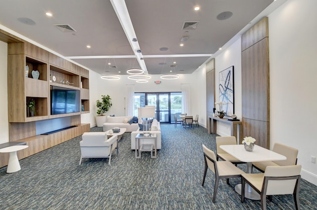 living area with recessed lighting, visible vents, baseboards, and dark carpet