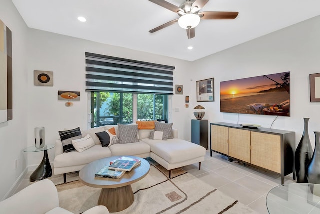 living room featuring light tile patterned flooring, a ceiling fan, recessed lighting, and baseboards