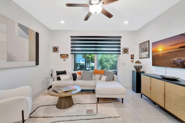 living area featuring light tile patterned floors, recessed lighting, baseboards, and ceiling fan