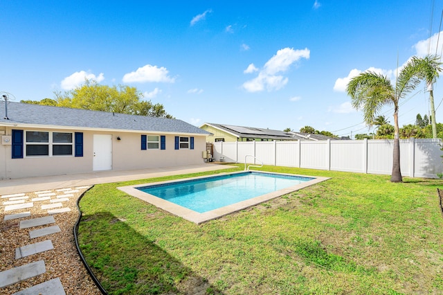 view of swimming pool with a lawn, a patio area, a fenced backyard, and a fenced in pool