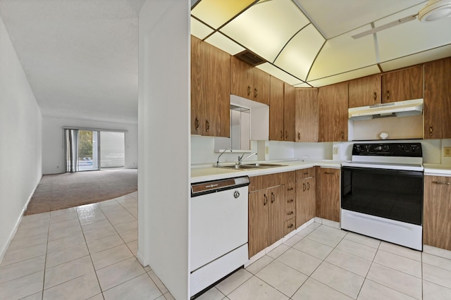 kitchen with light tile patterned floors, electric range, white dishwasher, a sink, and under cabinet range hood