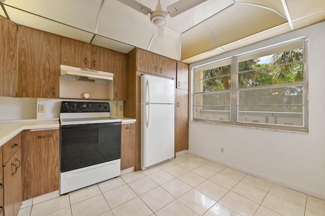 kitchen with white appliances, a ceiling fan, brown cabinetry, light countertops, and under cabinet range hood