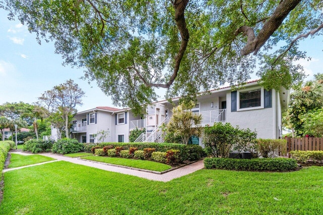 view of front of property with a front lawn and stucco siding