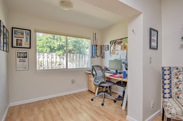 office area with wood finished floors and baseboards