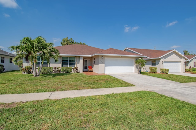 ranch-style home featuring stucco siding, driveway, a front lawn, and an attached garage