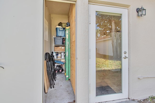 view of exterior entry featuring stucco siding