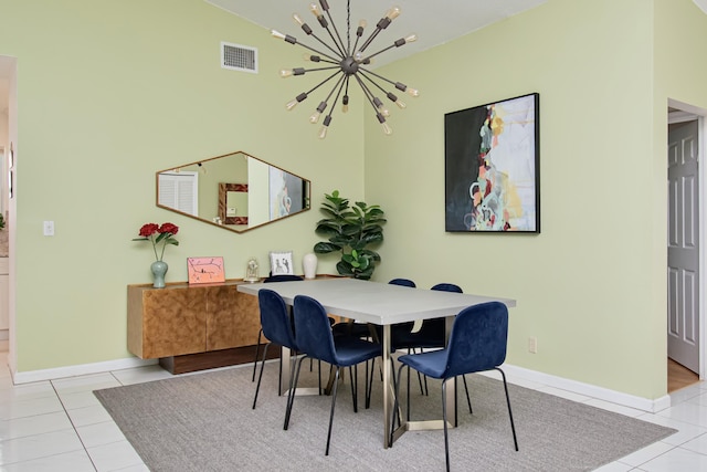 dining area featuring tile patterned floors, visible vents, baseboards, and a chandelier