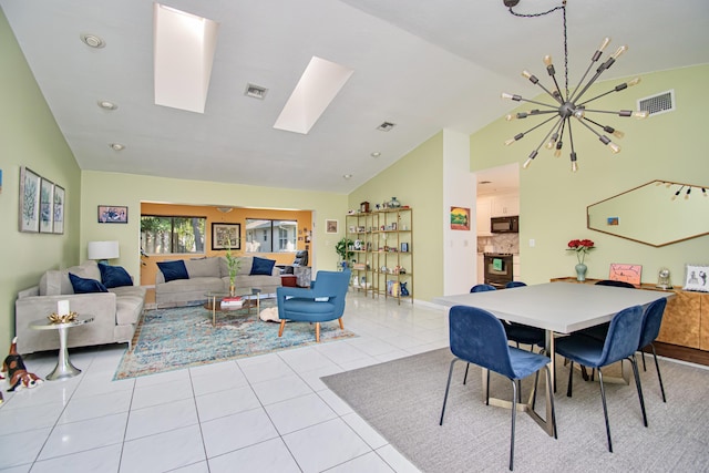 tiled living room with high vaulted ceiling, a skylight, visible vents, and a chandelier