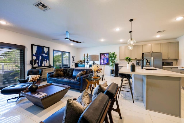 living area with recessed lighting, visible vents, ceiling fan, and light tile patterned flooring