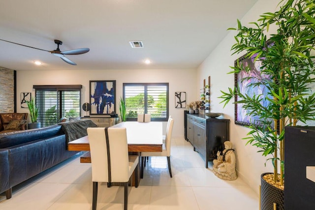 dining area featuring visible vents, plenty of natural light, and light tile patterned floors