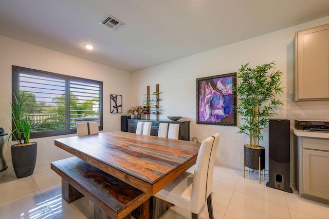 dining area with baseboards, light tile patterned flooring, visible vents, and recessed lighting