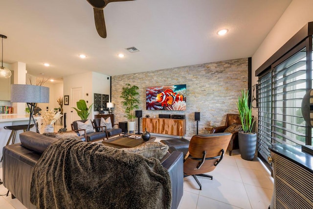 living area with ceiling fan, light tile patterned flooring, recessed lighting, an accent wall, and visible vents