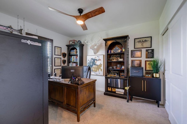 office space with carpet floors and a ceiling fan