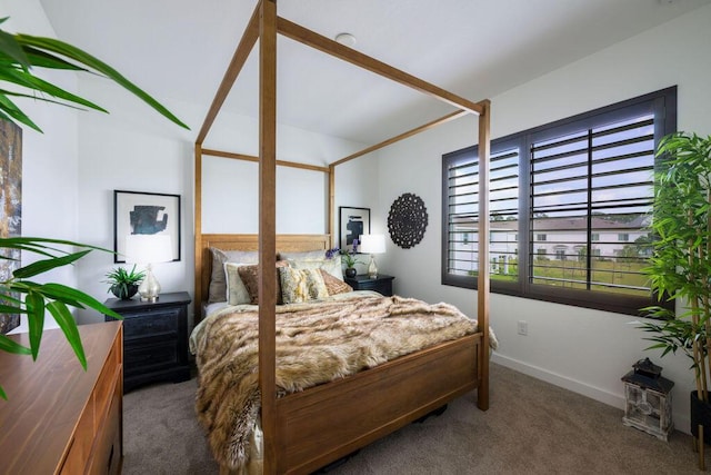 bedroom with carpet and baseboards