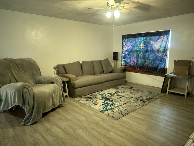 living area featuring wood finished floors and a ceiling fan