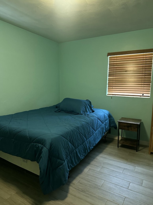 bedroom with light wood-type flooring