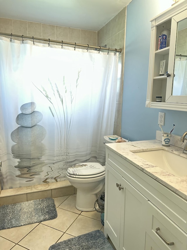 full bath featuring curtained shower, toilet, and tile patterned floors