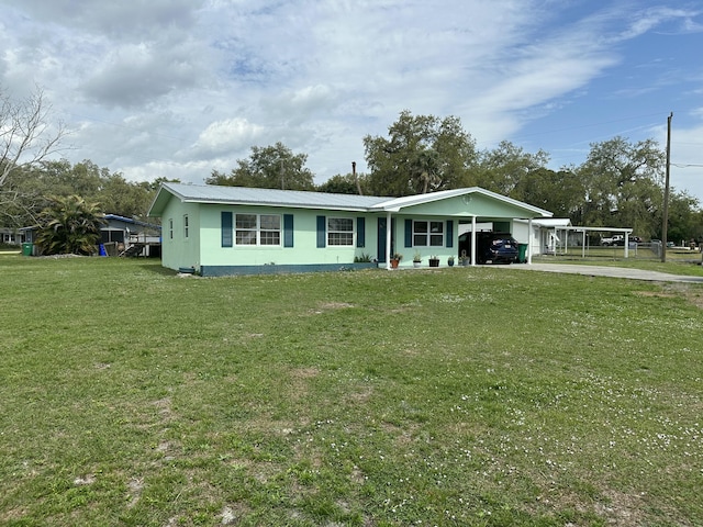 view of front of home with metal roof and a front yard