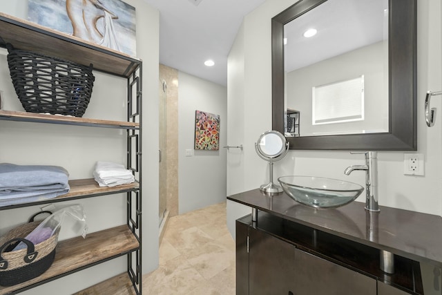 bathroom featuring recessed lighting and vanity