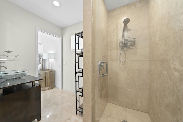 bathroom featuring a stall shower and vanity